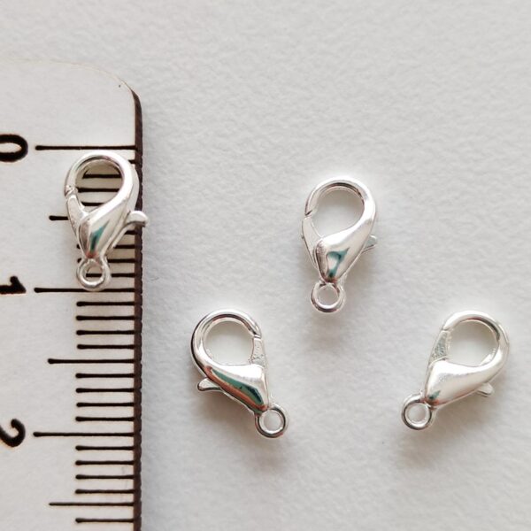 Fecho mosquetão 10 mm em metal cor prateado claro