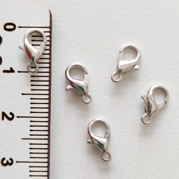 Fecho mosquetão 10 mm em metal cor prateado escuro