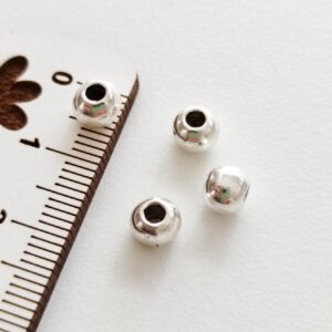 Separador em metal prateado 6mm-furo 2mm