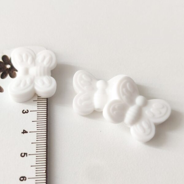 Conta em silicone borboleta 25 mm Branca- para prende chucha