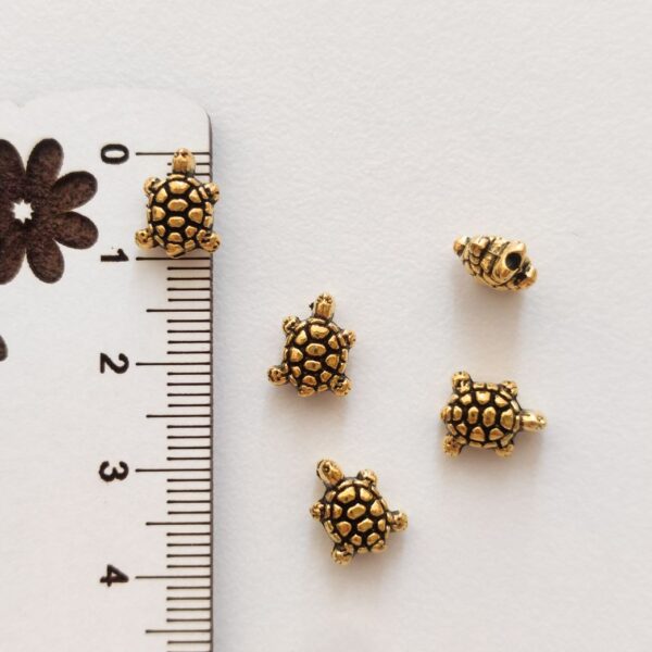 Entremeio metálico - Tartaruga - 10 mm - Dourado