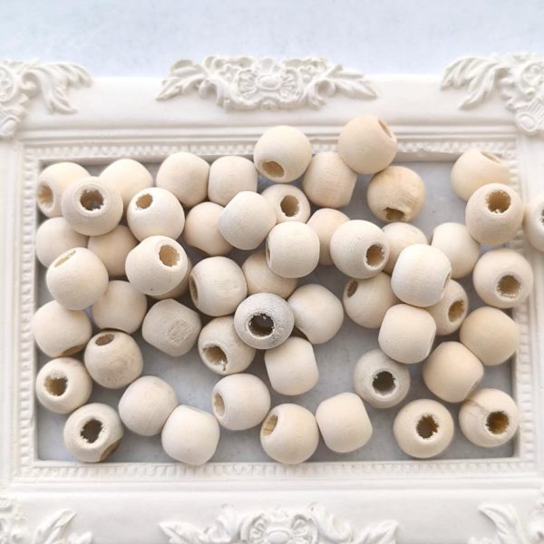 Contas em madeira natural 10 mm/ furo 3 mm